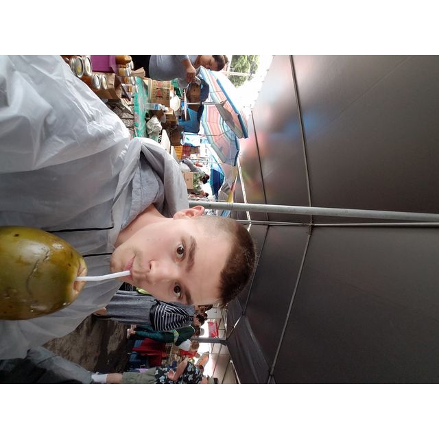 spencer drinking coconut, hilo farmers’ market
